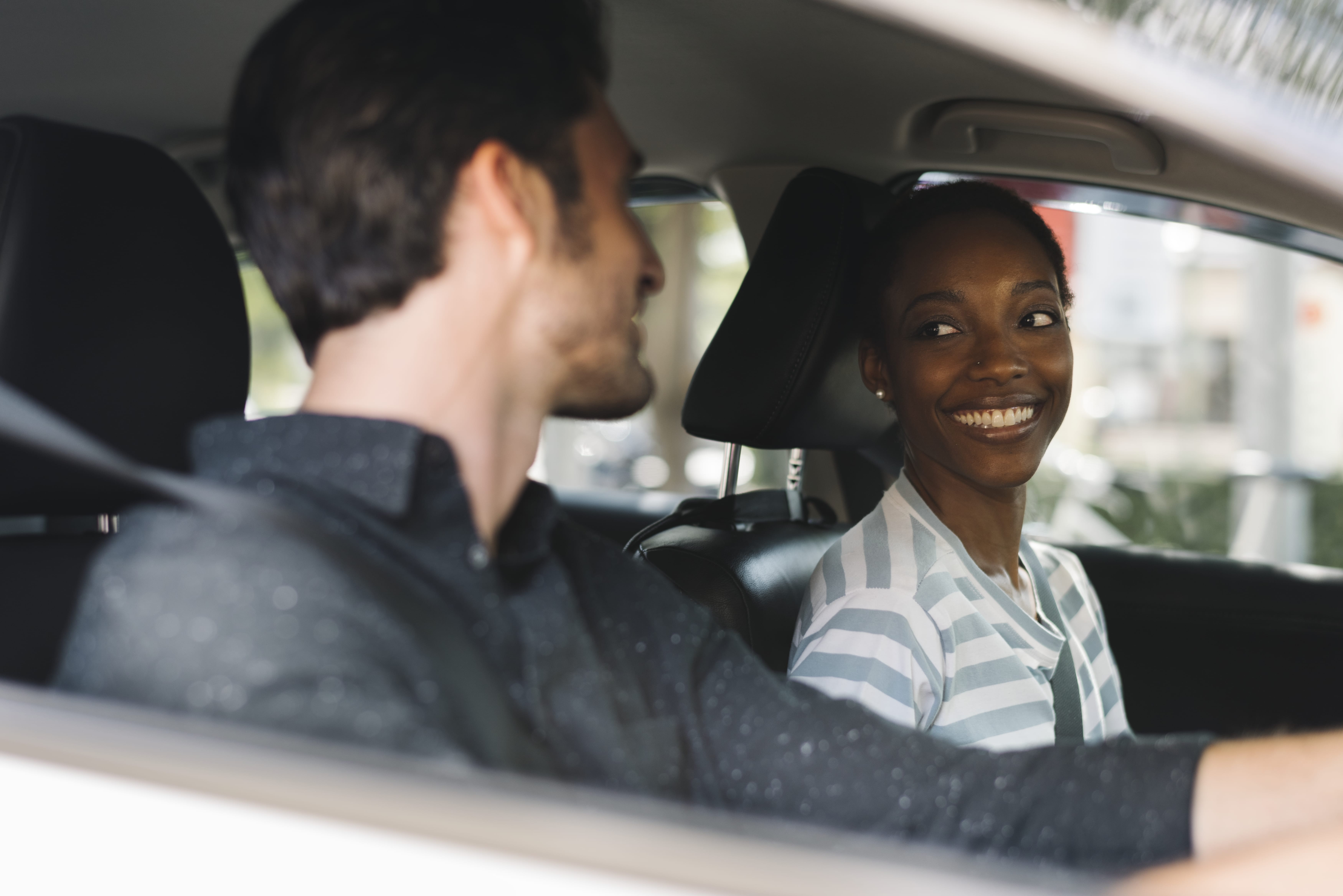couple learning to drive together in a car